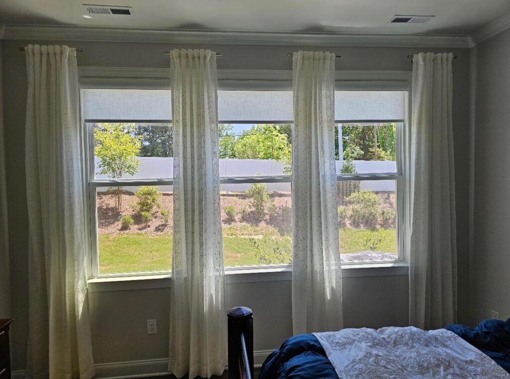 light filtering roller shades layered with sheep drapes